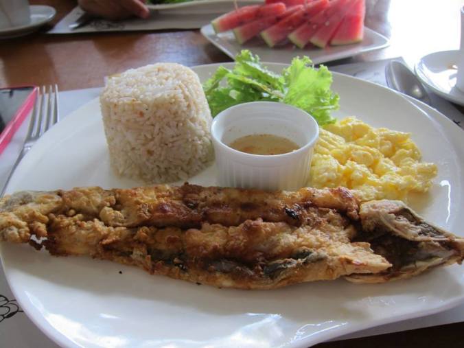 Crispy fried Bangus with spiced vinegar, scrambled eggs and garlic rice - a Filipino classic.